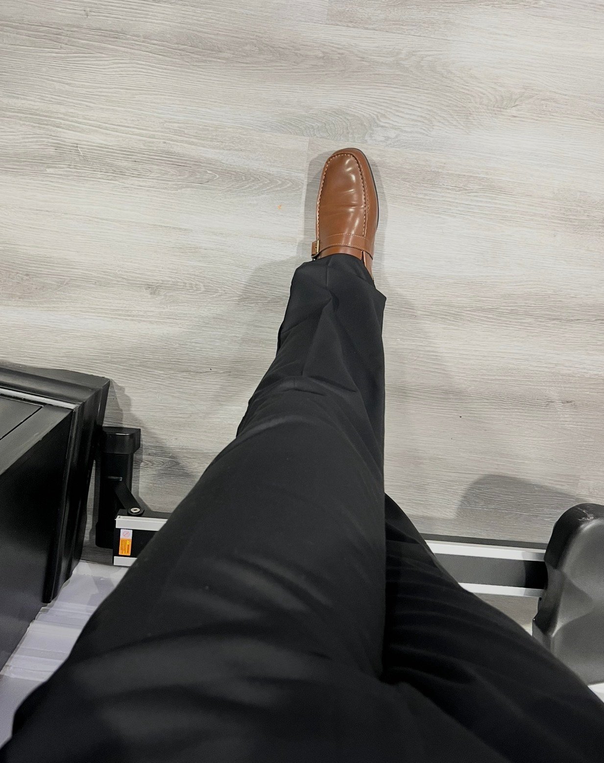 A polished shoe stepping forward